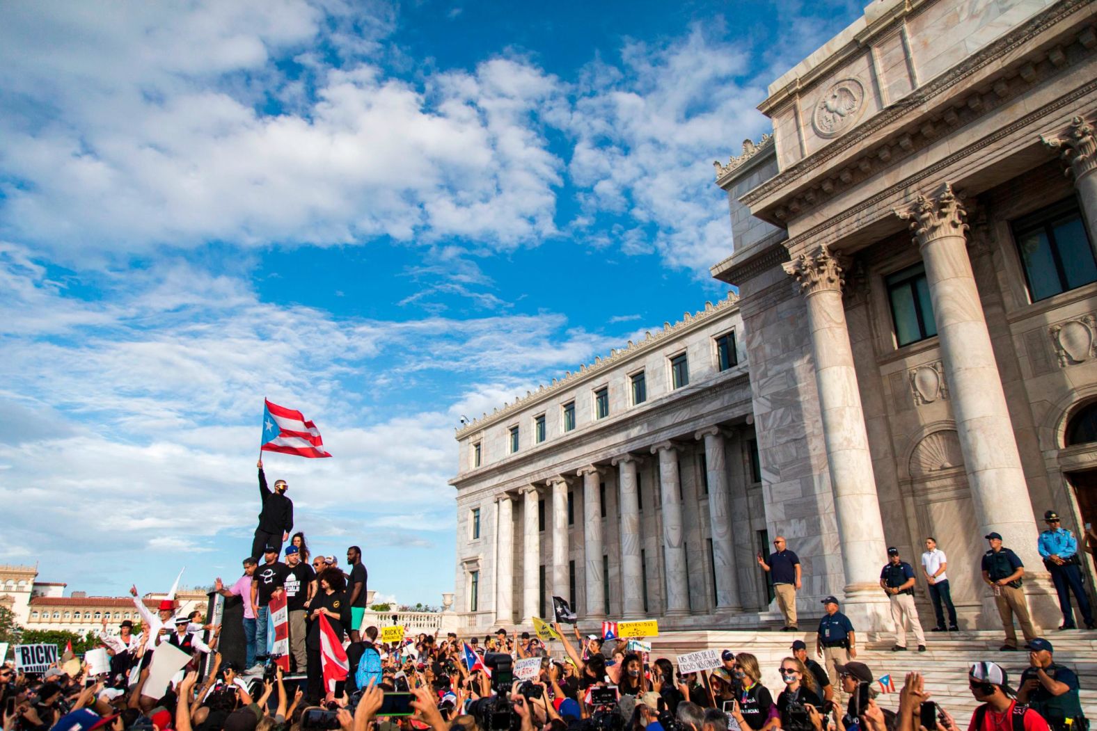 Rapper Benito Antonio Martinez Ocasio, known by his stage name Bad Bunny, holds a Puerto Rican flag before a march on July 17.