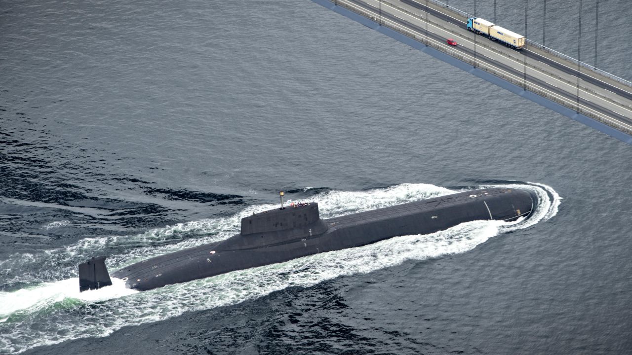 The Russian nuclear submarine Dmitrij Donskoj sails under the Great Belt Bridge between Jyutland and Fun through Danish waters, near Korsor, on July 21, 2017, on it's way to Saint Petersburg to participate in the 100th anniversary of the Russian Navy, held in on 29th - 30th July.
The submarine is 172 meters long and is thus the largest nuclear powered submarine in the world, and it's the first time it sails into the Baltic Sea. / AFP PHOTO / Scanpix Denmark AND Scanpix / Michael BAGER / Denmark OUT (Photo credit should read MICHAEL BAGER/AFP/Getty Images)
