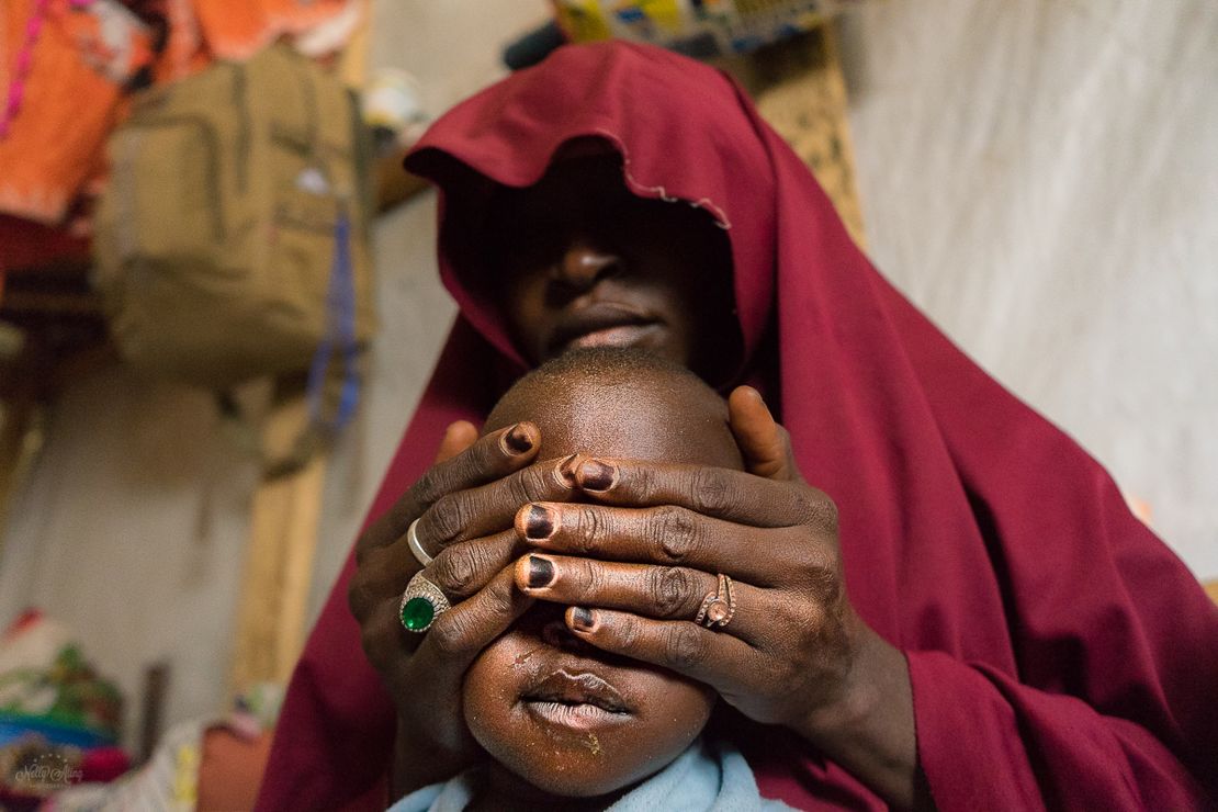 Falamatu, 35, with her son. She gave up her 12 year old daughter, Innakaru to marry a Boko Haram foot soldier. "The insurgents had seized my hometown Bama in Borno State. I live in regret, I pray my daughter Innakaru is safe and will forgive me"- Maiduguri, 2018
