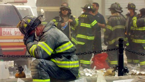 A firefighter breaks down after the World Trade Center buildings collapsed September 11, 2001 after two hijacked airplanes slammed into the twin towers in a terrorist attack.