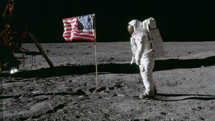 Apollo 11 Buzz Aldrin on moon next to flag