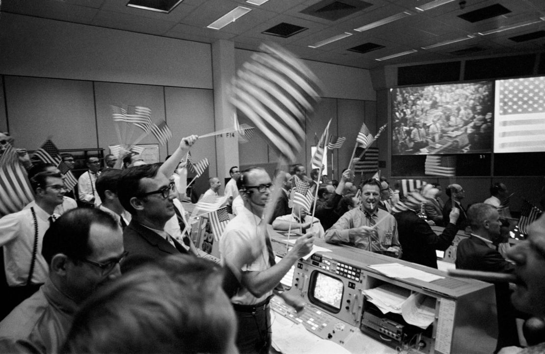 Celebrations of the lunar landing in the Mission Operations Control Room.