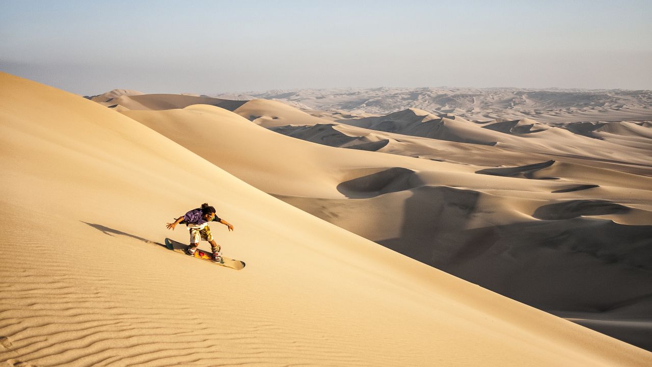 Sandboarding is similar to snowboarding but takes place on sand dunes.