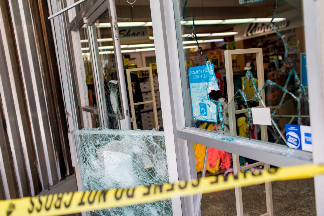 A department store's windows are broken Thursday, after protests the previous night in San Juan.