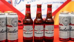 Budweiser beer products manufactured by Anheuser-Busch InBev NV sit on display during a news conference in Hong Kong, China, on Thursday, July 4, 2019. Jan Craps, chief executive officer of Budweiser Brewing Company APAC Ltd., poses for photos during a news conference in Hong Kong, China, on Thursday, July 4, 2019. The IPO of Budweiser Brewing Company APAC, which is set to raise as much as $9.8 billion in Hong Kong later this month, will give AB InBev more flexibility to seek local partners, Chief Executive Officer Jan Craps said at a press conference in Hong Kong. Photographer: Kyle Lam/Bloomberg via Getty Images