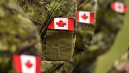 Canada patch flags on soldiers arm. Canadian troops