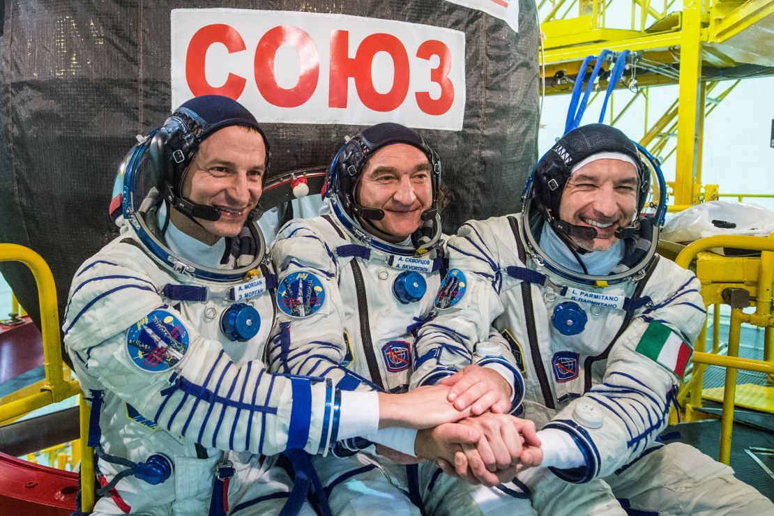 Expedition 60 crew members Andrew Morgan of NASA, Aleksandr Skvortsov of the Russian space agency Roscosmos and Luca Parmitano of ESA in front of their Soyuz MS-13 spacecraft in July 2019.