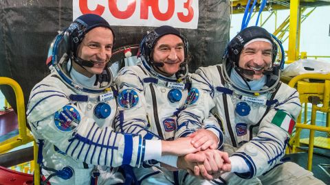 Expedition 60 crew members Andrew Morgan of NASA, Aleksandr Skvortsov of the Russian space agency Roscosmos and Luca Parmitano of ESA in front of their Soyuz MS-13 spacecraft in July 2019.
