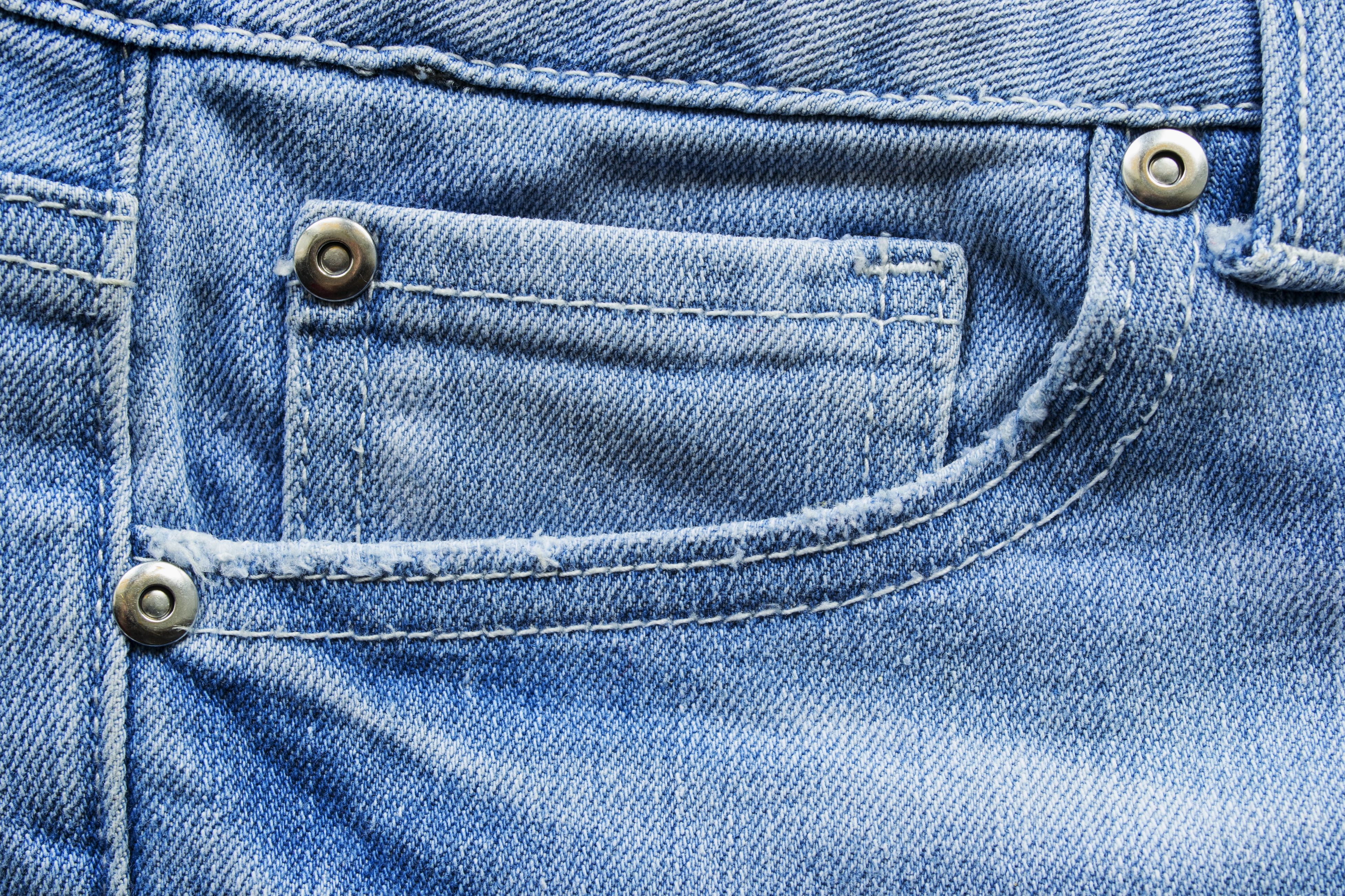 This Is The Reason Your Jean Pockets Have Tiny Buttons On Them