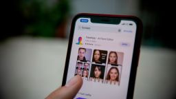 This illustration picture shows FaceApp application displayed on the screen of a smartphone. - The popular app is in the in the eye of a political storm in the United States, with one senator urging an FBI investigation into its "national security and privacy risks".  (Photo illustration by Manuel Romano/NurPhoto via Getty Images)