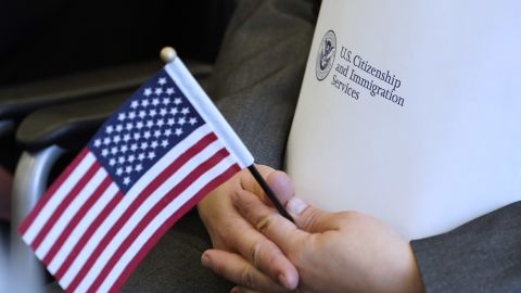 An applicant waits to take the oath to become a US citizen on April 10, 2019, in Salt Lake City.