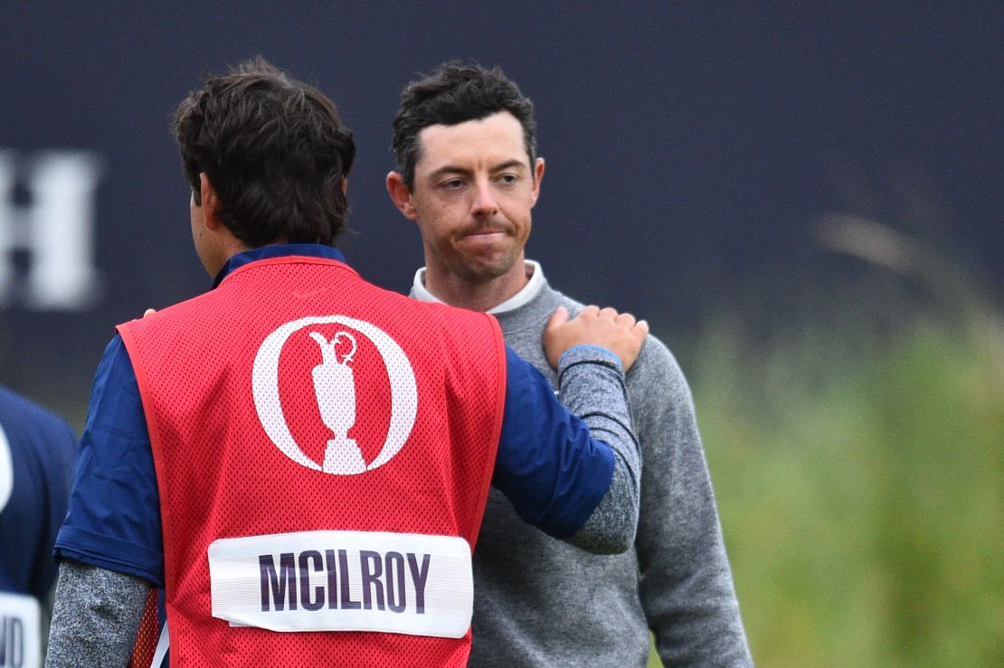McIlroy is consoled by caddie and best friend Harry Diamond.