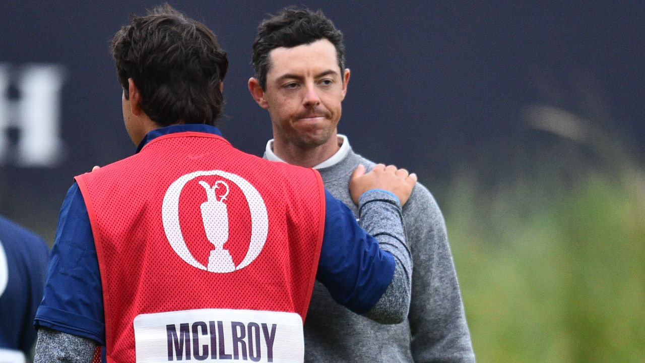 McIlroy is consoled by caddie and best friend Harry Diamond.