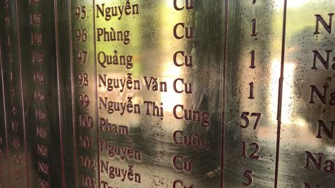 The names of three 1-year-olds, victims of the My Lai massacre, are grouped together on a memorial wall at a museum in Son My, Vietnam.