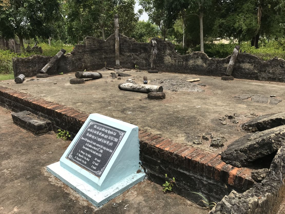 The foundation of a hut in My Lai village, destroyed by US troops on March 15, 1968. The marker in front lists those who lived there and died in the My Lai massacre.