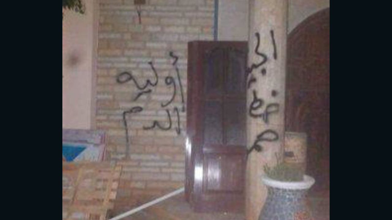 As the masked men left the house, they sprayed graffiti on the walls -- including the group's name and a warning in Arabic: "Don't cross the line of the armies." 