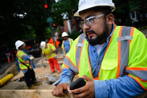 Albert Tapia, 29, a foreman for PowerComm Construction, Inc., works at a construction site on 13th Street in Washington, DC, on July 18. 