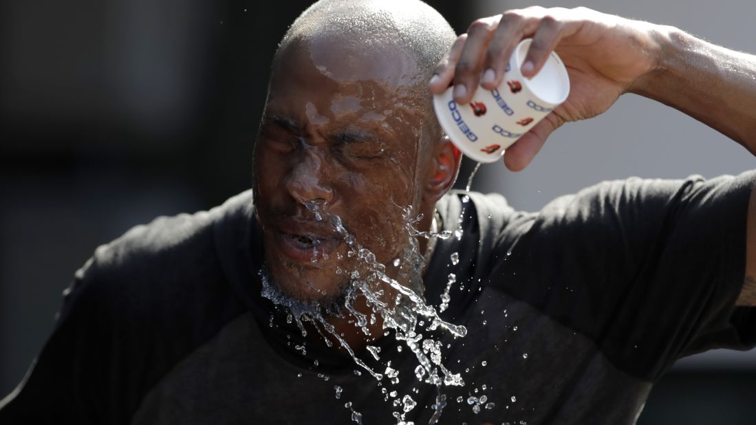 Baltimore Orioles outfielder Keon Broxton douses himself with water prior to a baseball game against the Boston Red Sox in Baltimore, Maryland, on Friday, July 19.