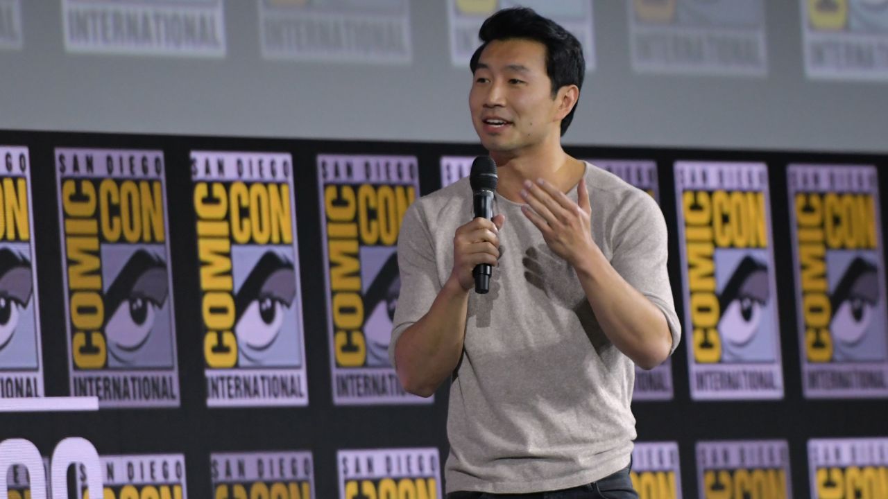 Simu Liu speaks on stage for the Marvel panel at  Comic-Con on Saturday. (Photo by Chris Delmas / AFP)