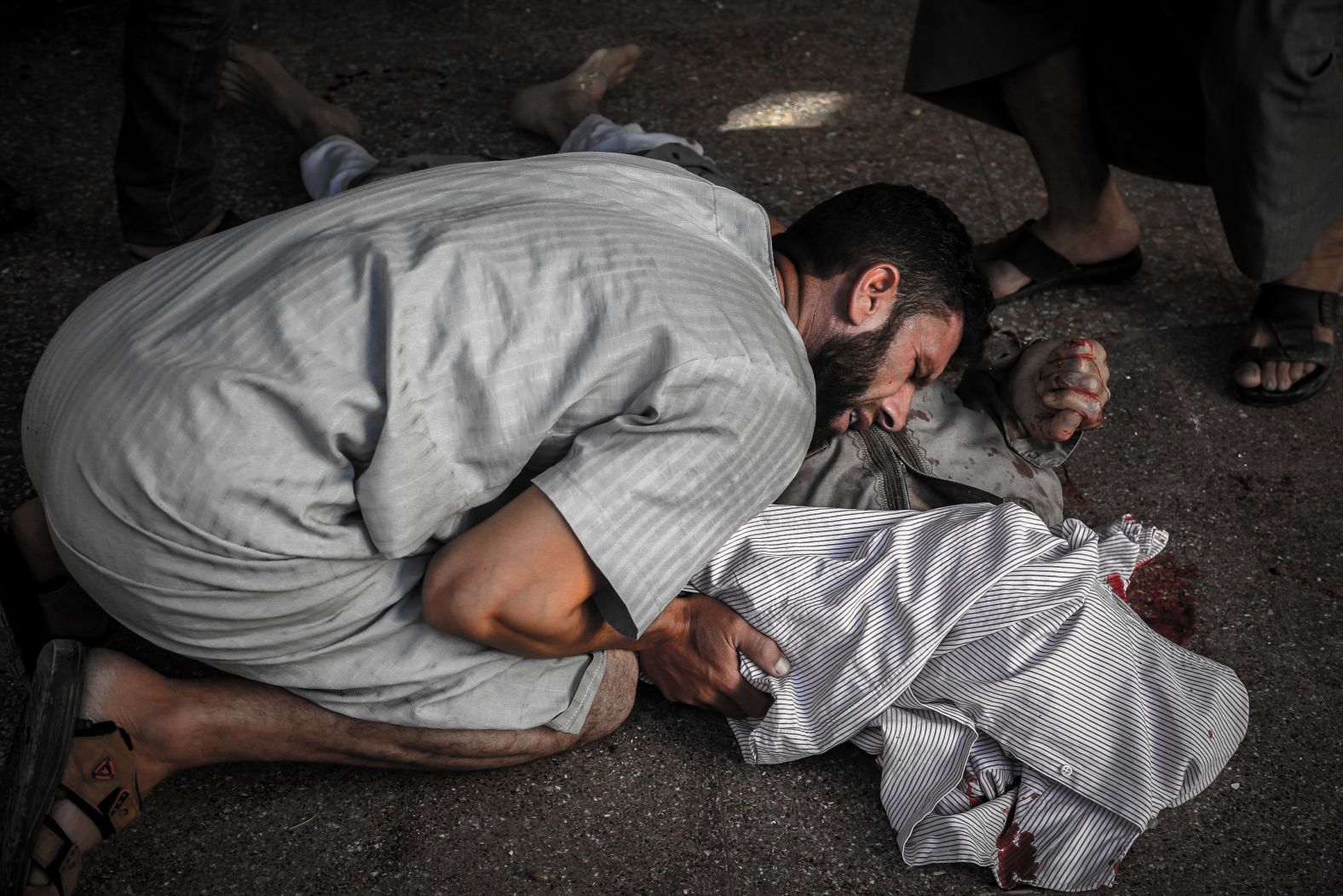 Al-Dyab was a freelance photographer for Agence France Presse and often took photos from the front lines of the war, such as this photo of a man grieving next to a dead body after heavy shelling by the Syrian regime's warplanes and helicopters in the city of Khan Sheikhoun on August 10, 2018.