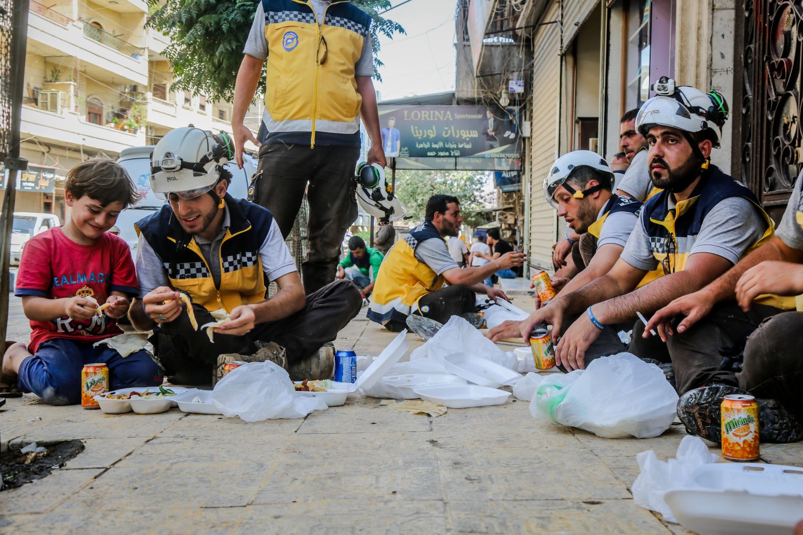 Nine-year-old Ismail from the Afrin area spends time with the White Helmets on August 8, 2018. "Anas was not able to live like other youths in his age, when the revolution started he was not able to complete his education. He decided to document the war instead," said Kutini.