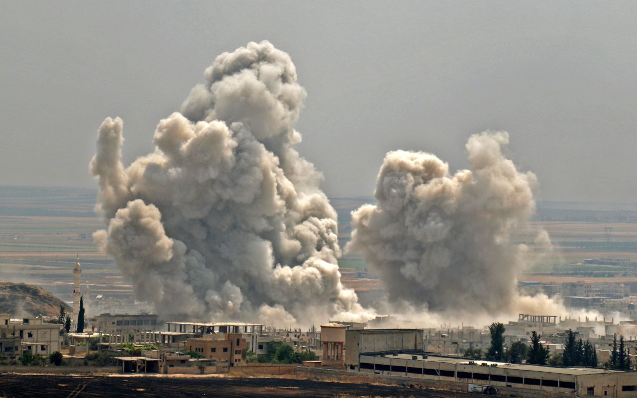 Plumes of smoke rise following a reported Syrian government forces' bombardment on the town of Khan Sheikhoun on June 7, 2019. During the CNN interview, al-Dyab said that he had been injured several times while covering these rescue missions, but he kept going because he believed strongly in his work with the White Helmets.