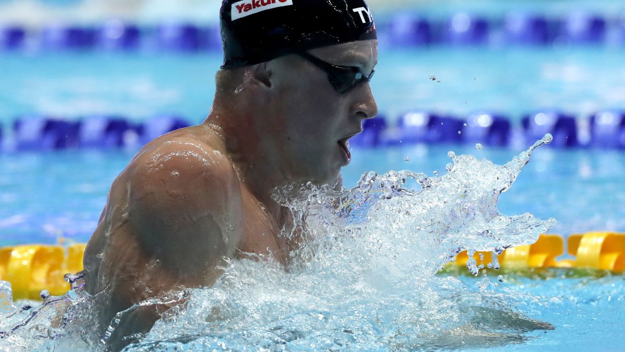 Britain's Adam Peaty broke his own record time in the men's 100-meter breaststroke semifinal at the World Swimming Championships in South Korea on Sunday. 