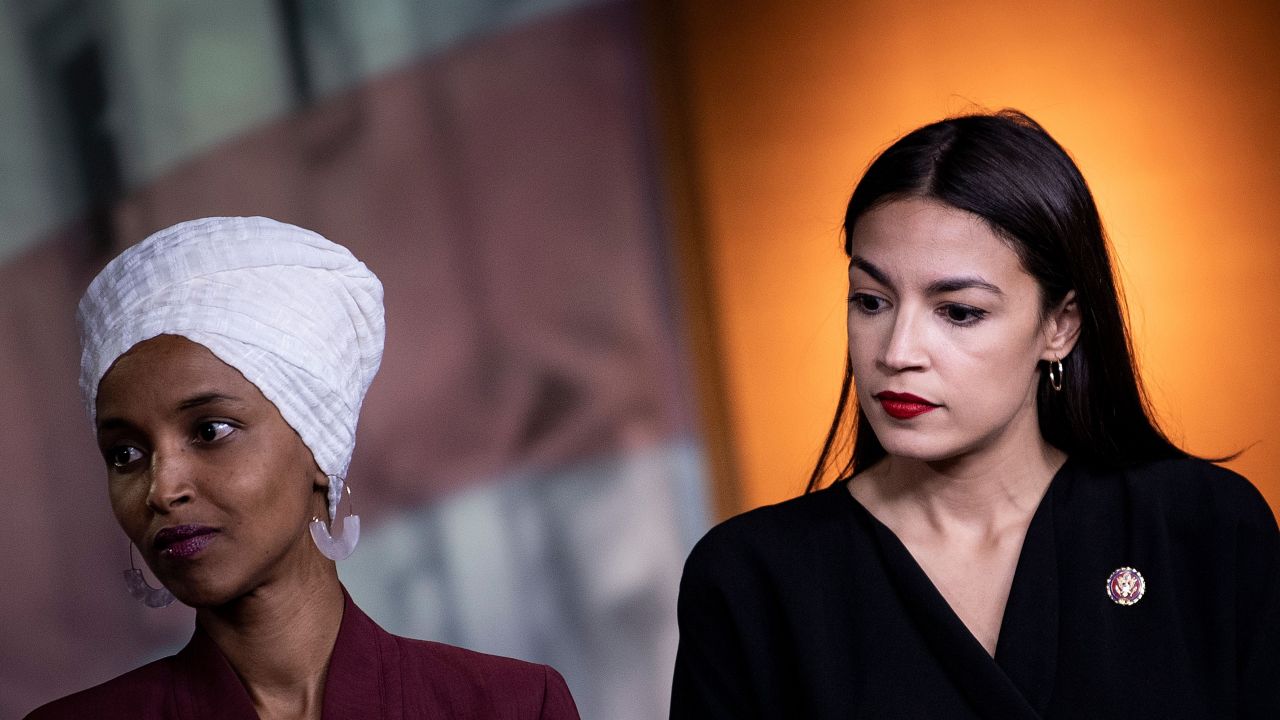 Democratic Reps. Ilhan Omar of Minnesota, at left, and Alexandria Ocasio-Cortez, at right, of New York listen during a press conference in July 2019.