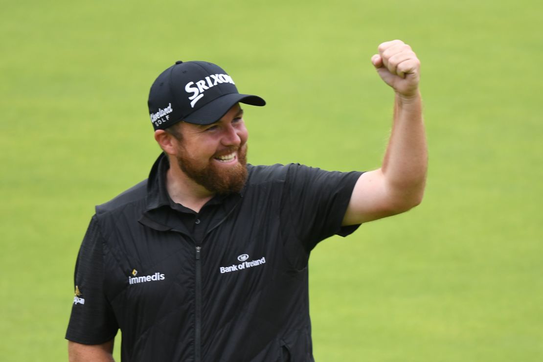 Shane Lowry celebrates as he walks up the 18th fairway on his way to winning the Open.