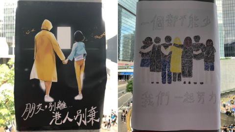 Protest posters depict a 35-year-old suicide victim in Admiralty, Hong Kong, on July 1, 2019. The one on the left reads: "Friend, don't leave, Hong Kong people, don't give up." On the right: "No one can be lacking, we need to work hard together."