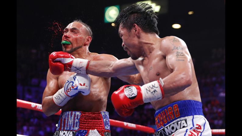 Manny Pacquiao, right, lands a punch against Keith Thurman in the fifth round during a welterweight title fight in Las Vegas on Saturday, July 20. The <a href="index.php?page=&url=https%3A%2F%2Fwww.cnn.com%2F2019%2F07%2F21%2Fsport%2Fpacquiao-thurman-boxing-welterweight-las-vegas-intl-spt%2Findex.html" target="_blank">40-year-old Pacquiao</a> defeated Thurman by split decision.