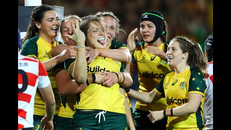 Grace Hamilton of the Wallaroos celebrates with her teammates after scoring a try during the second test of a match against Japan in Sydney, Australia, on Friday, July 19.