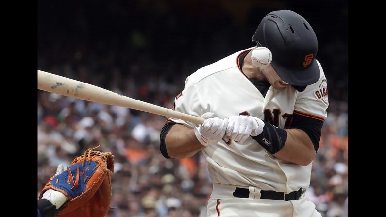 San Francisco Giants' Buster Posey is hit by a pitch during a baseball game against the New York Mets in San Francisco on Sunday, July 21.