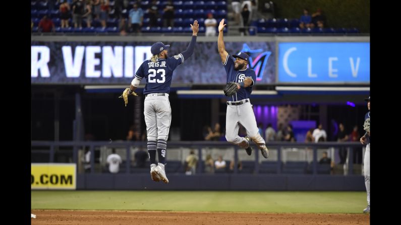 From left, Fernando Tatis Jr. of the San Diego Padres high fives teammate Manuel Margot after defeating the Miami Marlins in Miami on July 17.