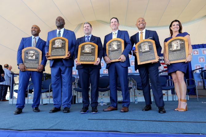From left, Baseball Hall of Fame Inductees Harold Baines, Lee Smith, Edgar Martinez, Mike Mussina, Mariano Rivera and Brandy Halladay, the widow of the late Roy Halladay, pose for a photo following the Hall of Fame Induction Ceremony at the National Baseball Hall of Fame in Cooperstown, New York, on Sunday, July 21.