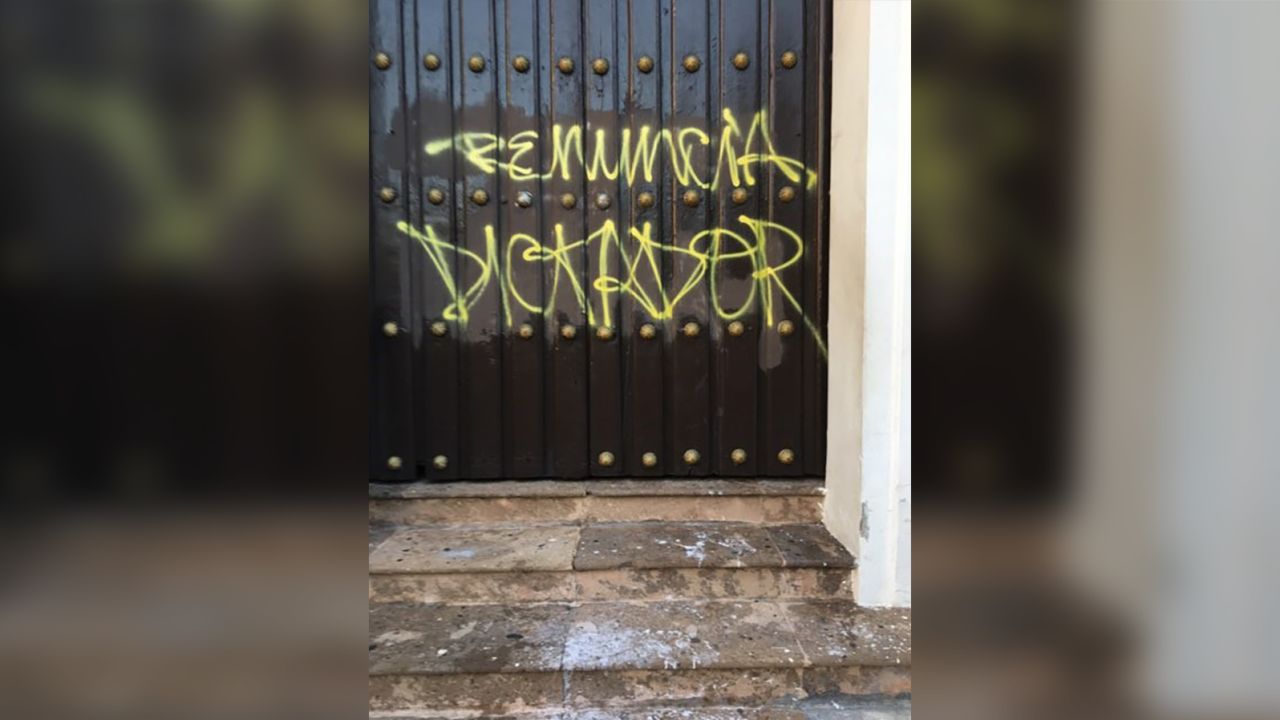 Last week, the doors of San Juan Bautista Cathedral in Puerto Rico were graffitied with the words "resign dictator."