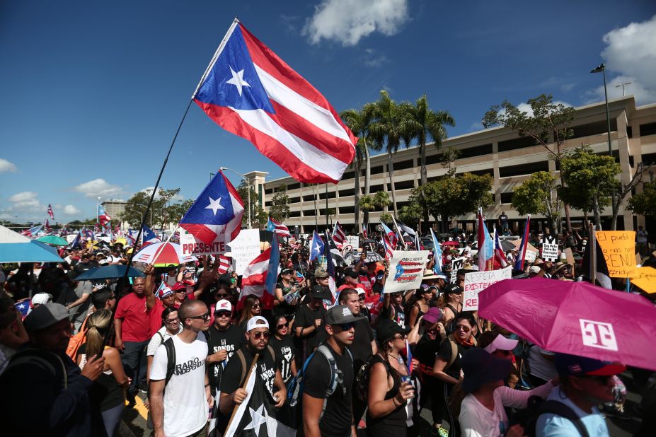 People join the rally against Rosselló on Monday.