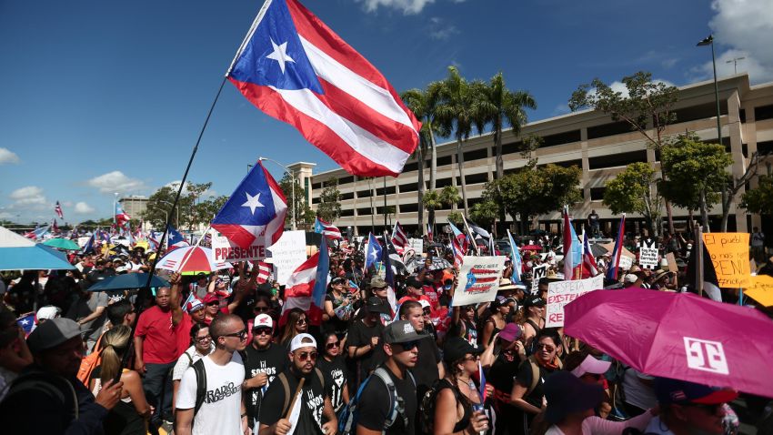 People join a rally against Puerto Rico Governor Ricardo Rossello demanding his resignation in San Juan, Puerto Rico Monday, July 22, 2019. 
