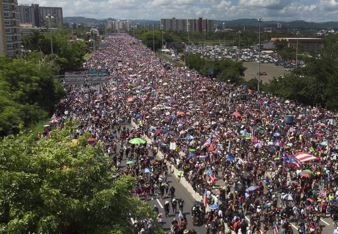 An aerial view from a drone shows thousands of people as they fill the Expreso Las Américas highway in San Juan.