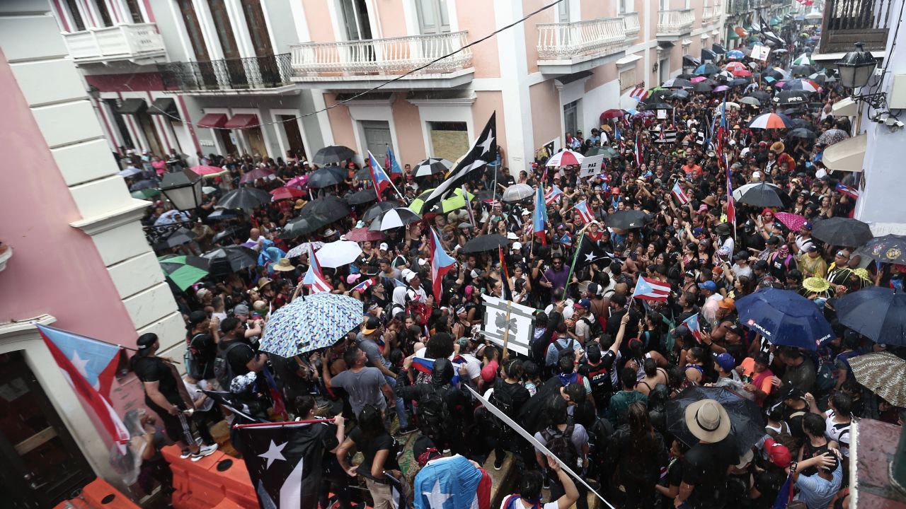 Protesters block the way to Rosselló's residence on Monday.