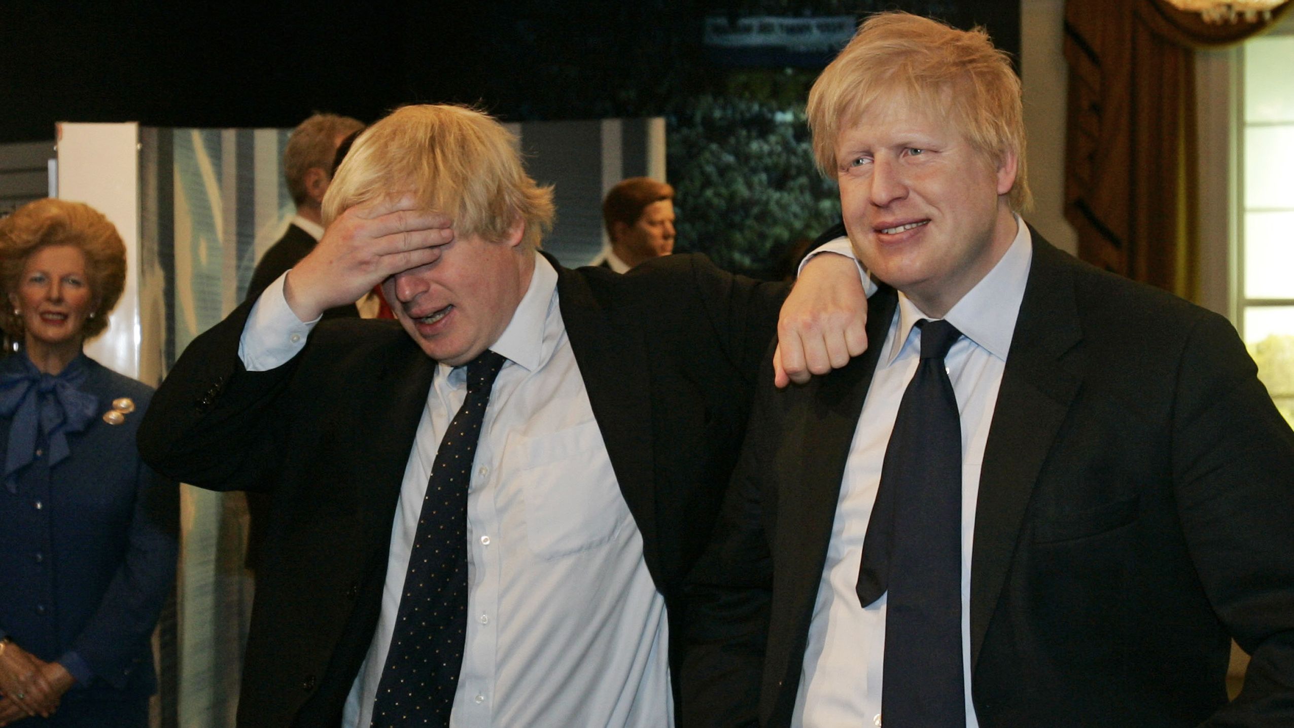 Johnson, left, poses with a wax figure of himself at Madame Tussauds in London in May 2009.