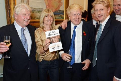 Johnson poses with his father, Stanley, and his siblings, Rachel and Jo, at the launch of his new book in October 2014. Stanley Johnson was once a member of the European Parliament.