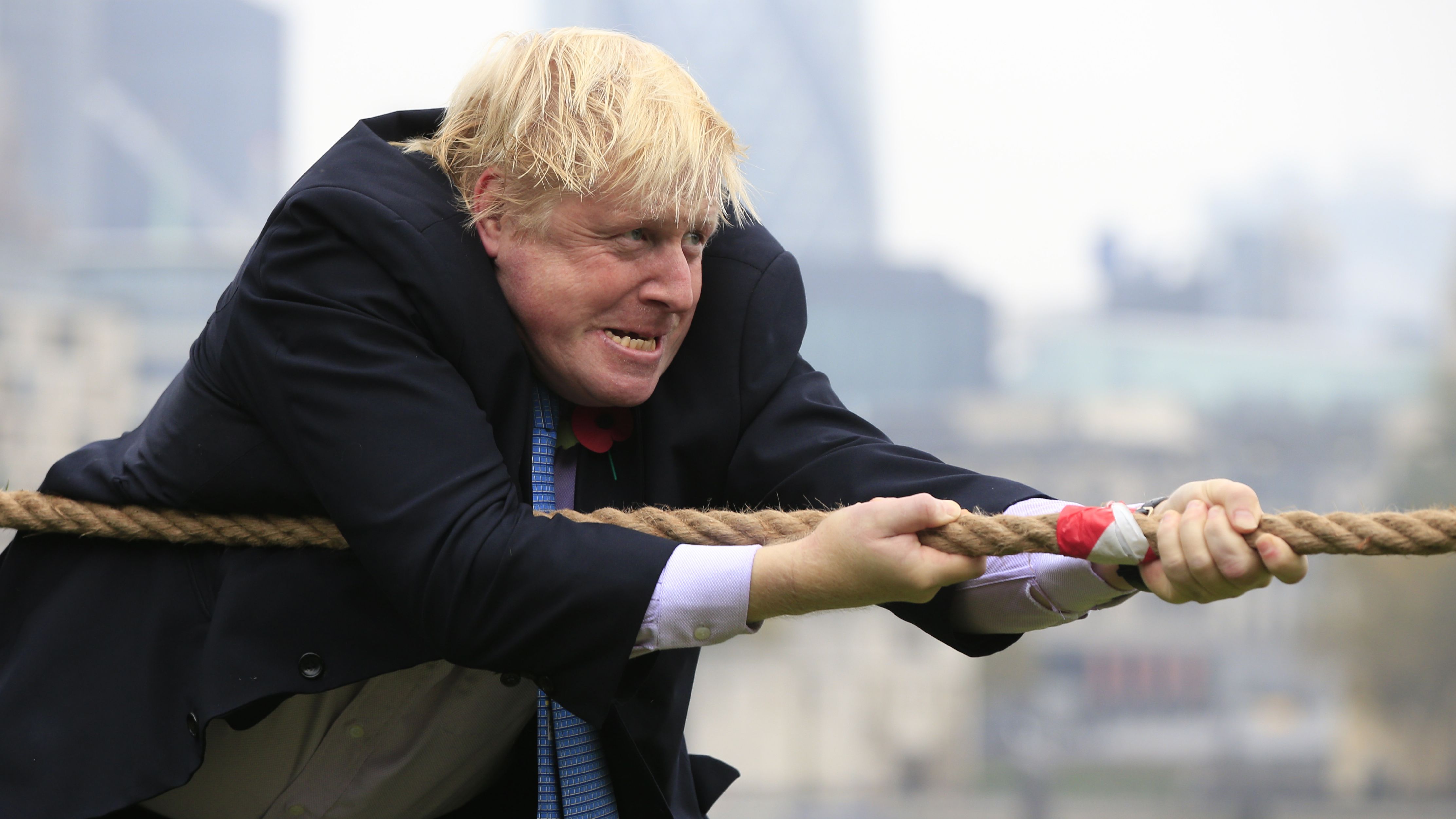 Johnson takes part in a charity tug-of-war  with British military personnel in October 2015.