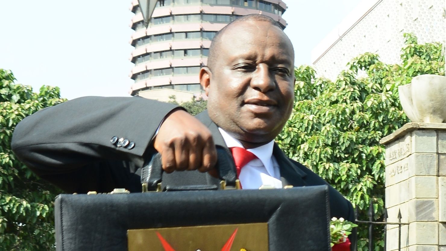 Henry Rotich displays Kenya's national budget briefcase in 2018.