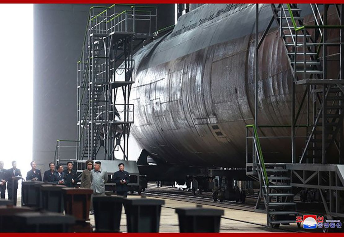 Kim is seen alongside what appears to be a sub in this image released by North Korean state media Tuesday.