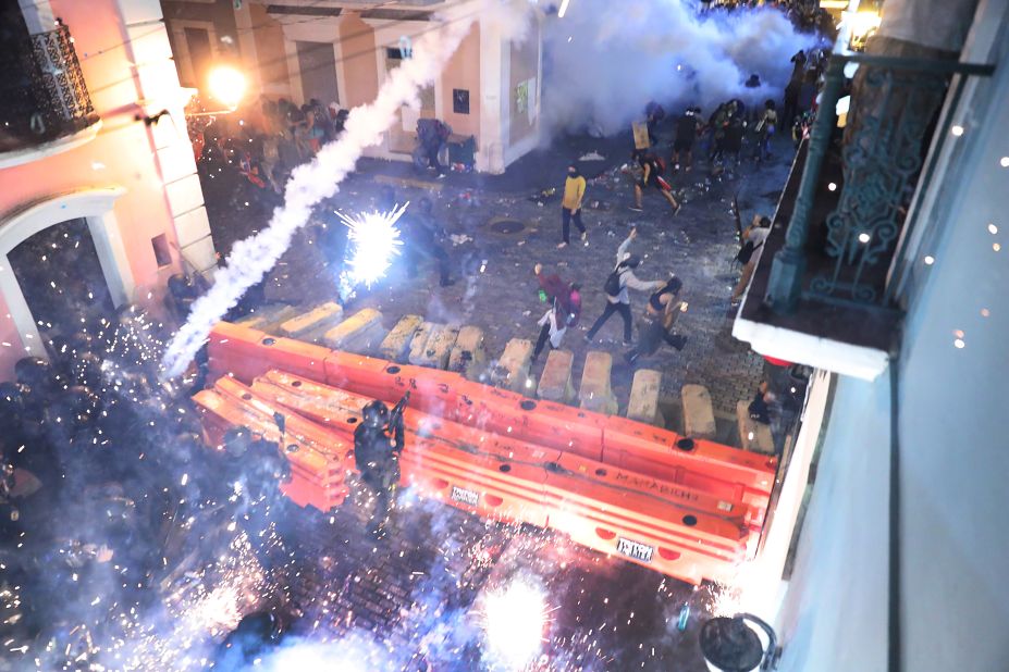 Police clash with protesters during demonstrations against Rosselló on Monday, July 22. The protests continued into Tuesday morning.