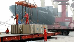 LIANYUNGANG, CHINA - JULY 15: Workers load boxes of Melamine Faced MDF onto a ship at Lianyungang Port on July 15, 2019 in Lianyungang, Jiangsu Province of China. China's GDP expanded 6.3 percent year-on-year in the first half of this year, according to the National Bureau of Statistics on Monday. (Photo by Wang Chun/VCG via Getty Images)