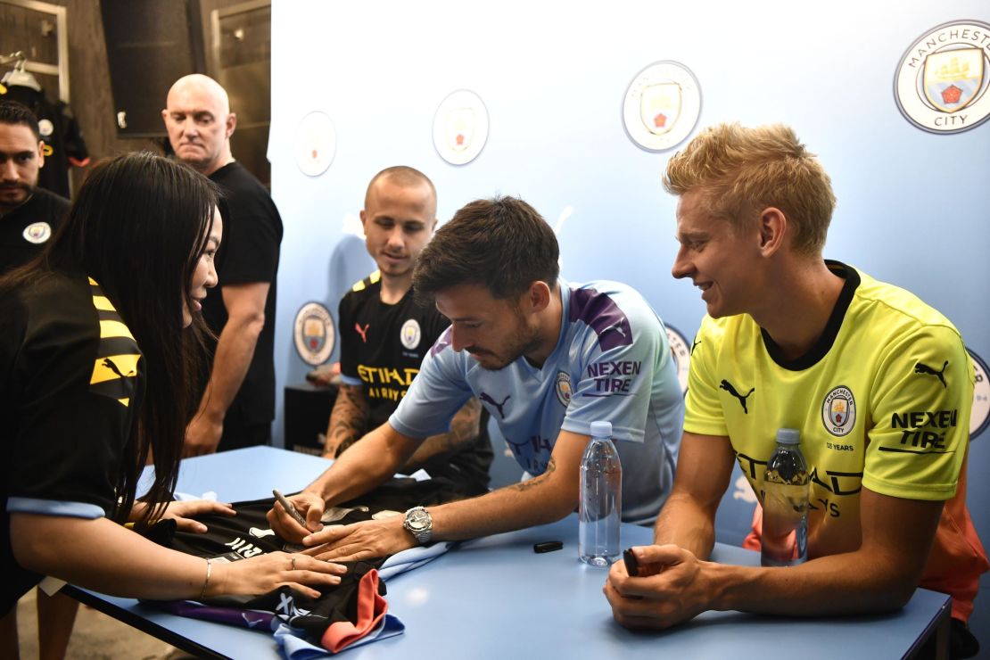 David Silva signs shirts for fans in Hong Kong.