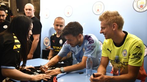 David Silva signs shirts for fans in Hong Kong.