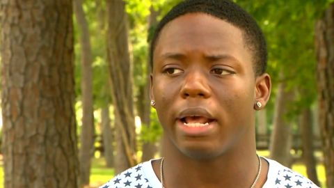 Grant Brown saved young his neighbor who was being attacked by a dog.